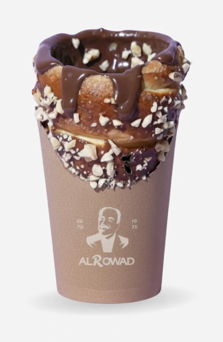 A chocolate-rimmed shake in an Al Rowad cup